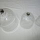 trio of old bells in transparent glass
