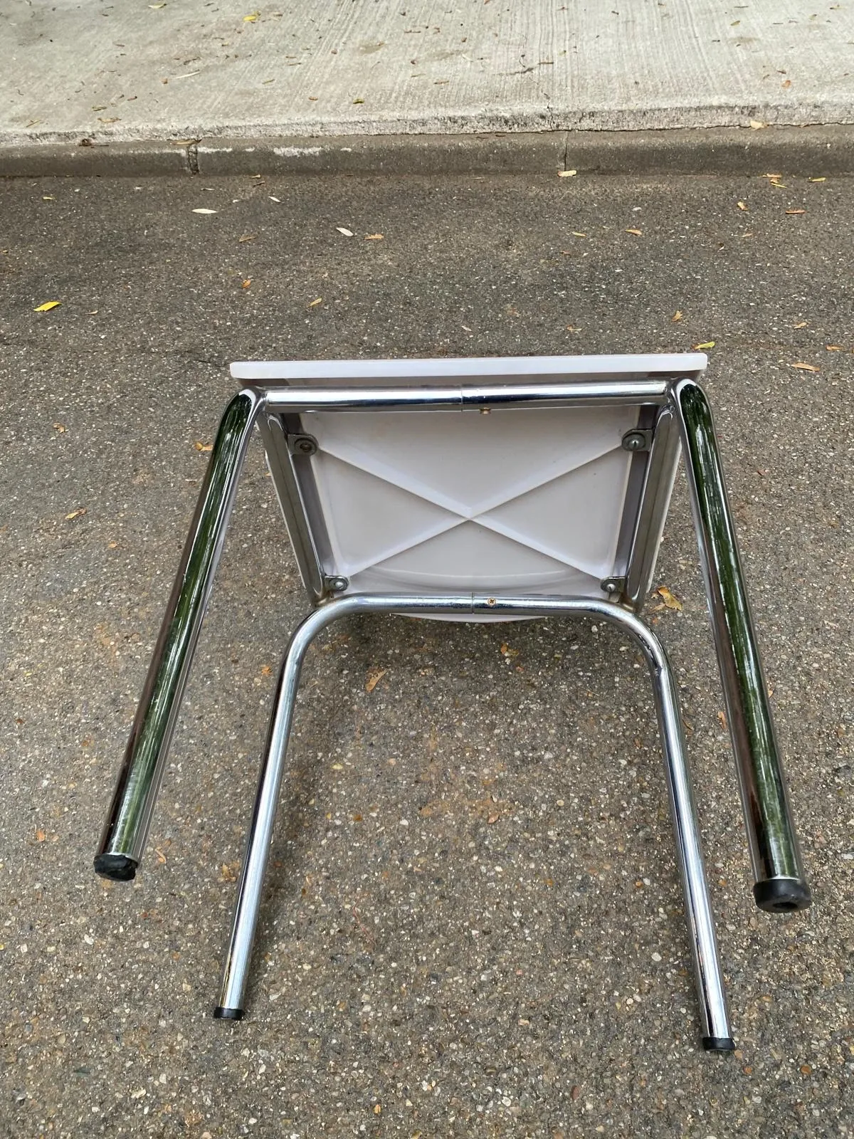 Space age chair with chrome metal and white schoolboy shell, desk 1970.