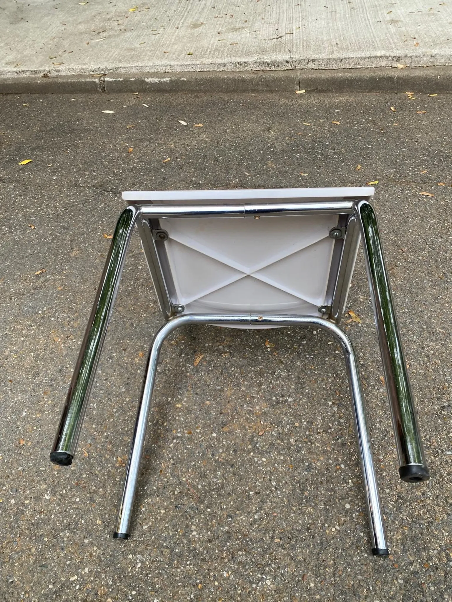Space age chair with chrome metal and white schoolboy shell, desk 1970.