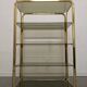 Hollywood Regency gilt metal and smoked glass shelf, Italy circa 1970