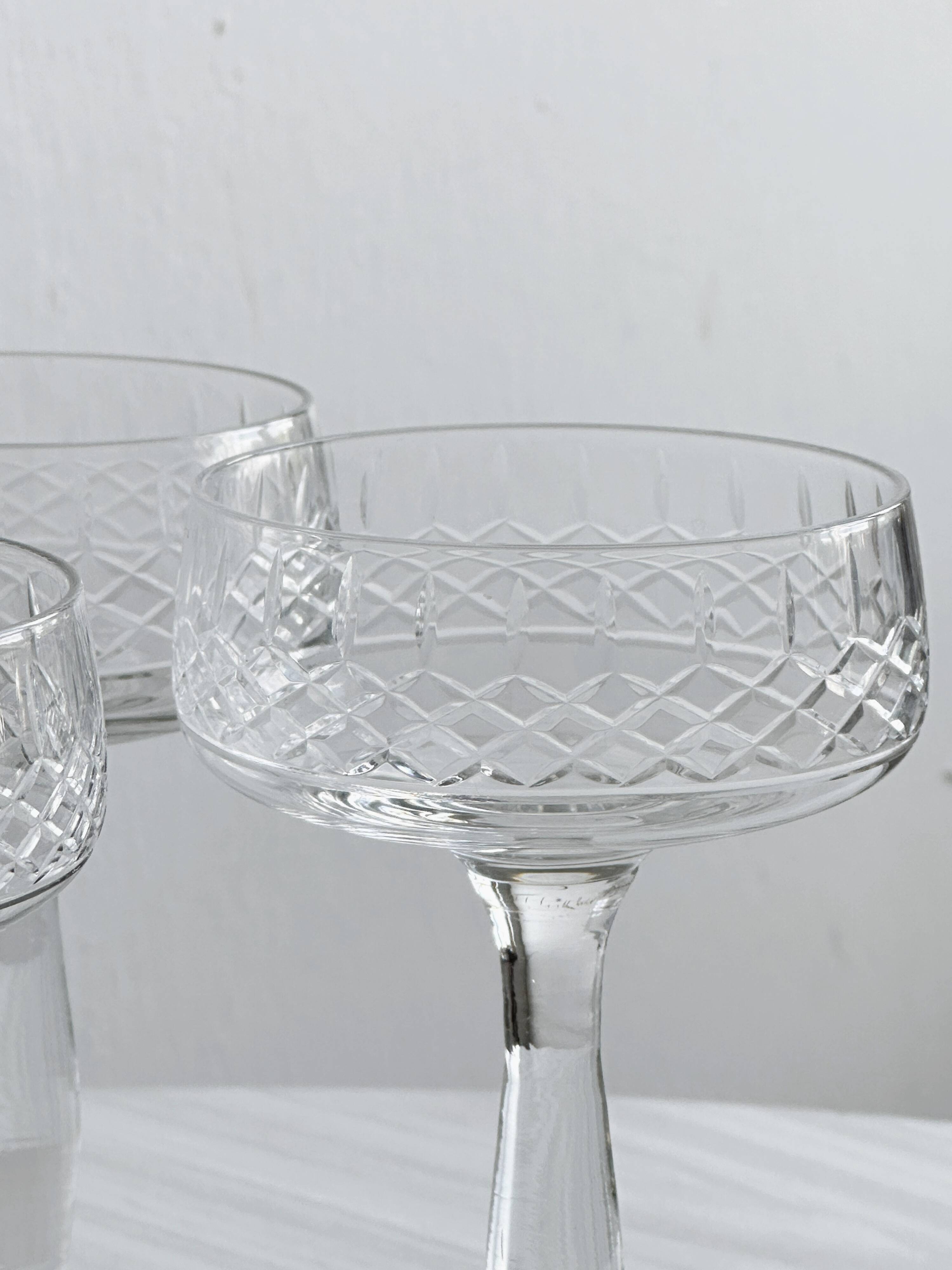 5 chiseled glass cocktail glasses.