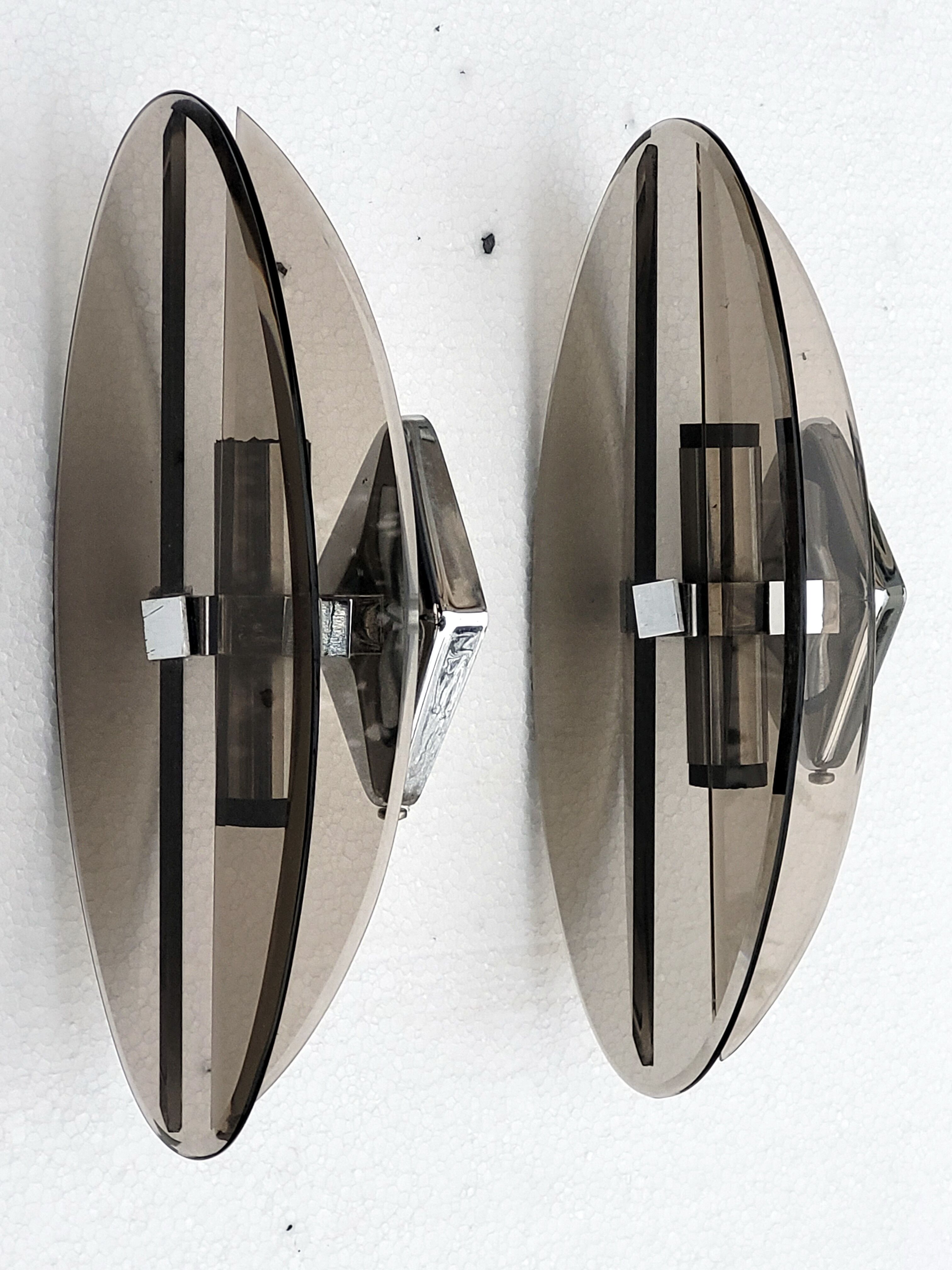 Pair of elliptical italian wall lamps in smoked glass and chrome veca