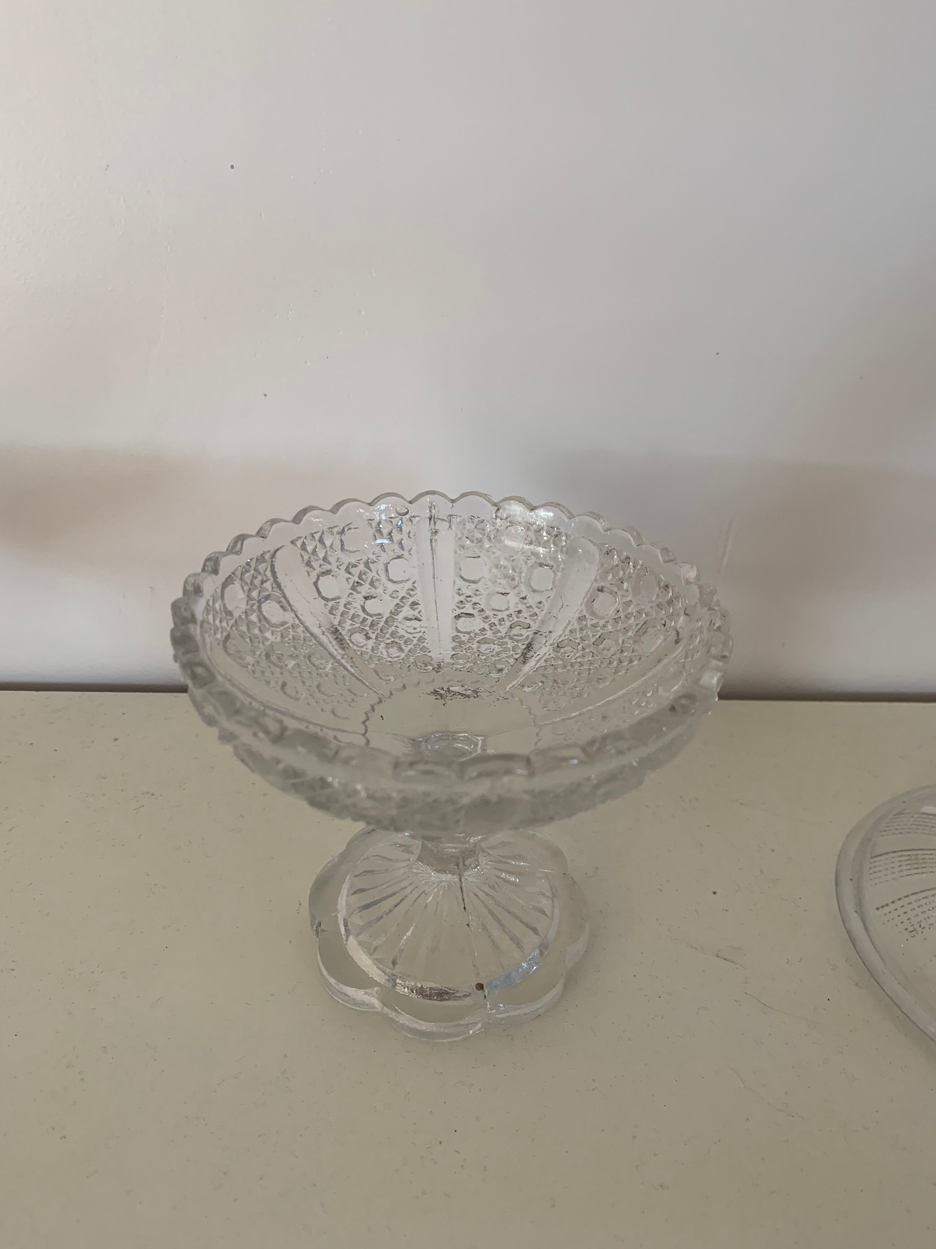 Two dredged cups in transparent glass geometric patterns in old relief