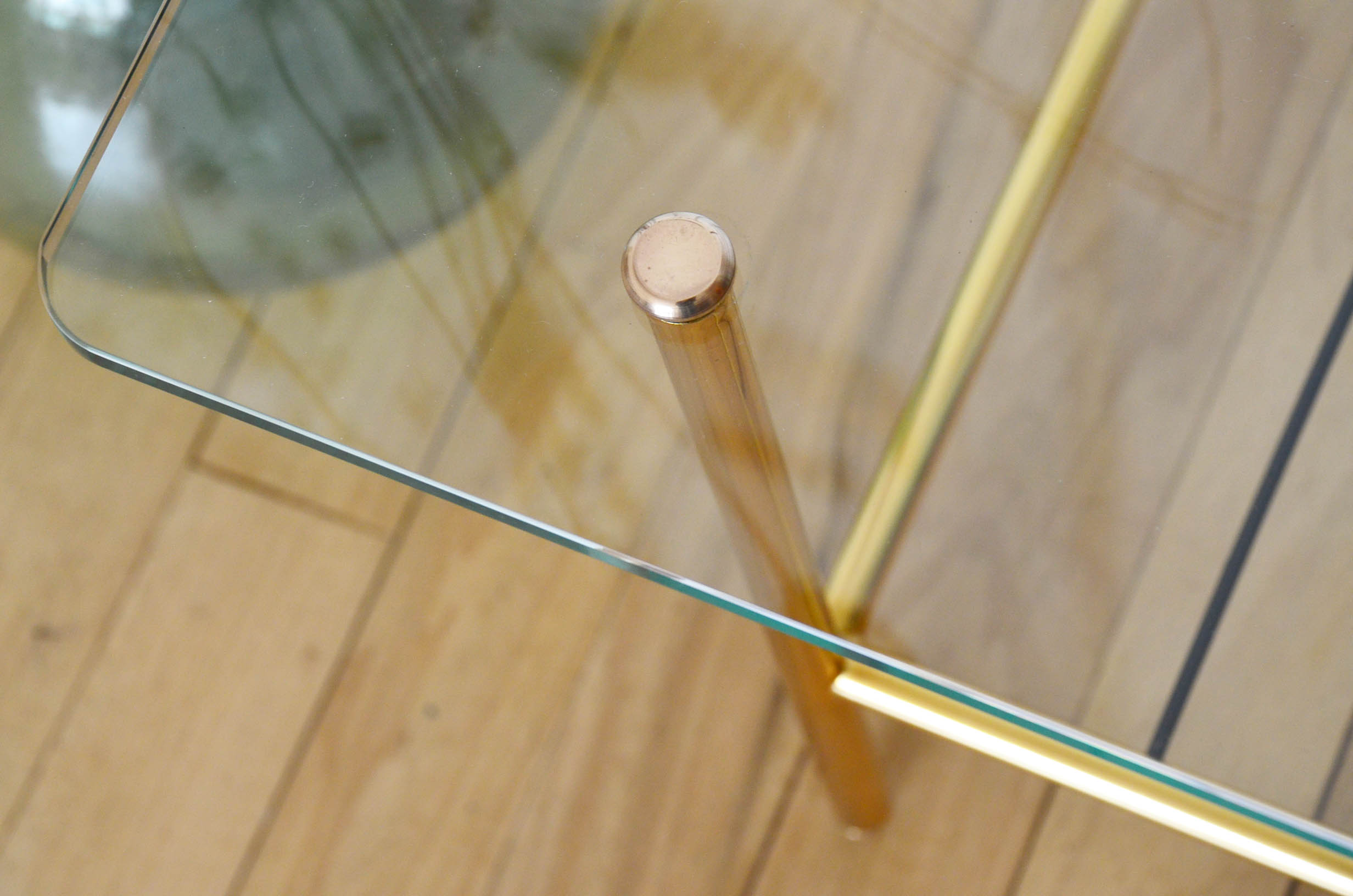 Glass coffee table with magazines holder