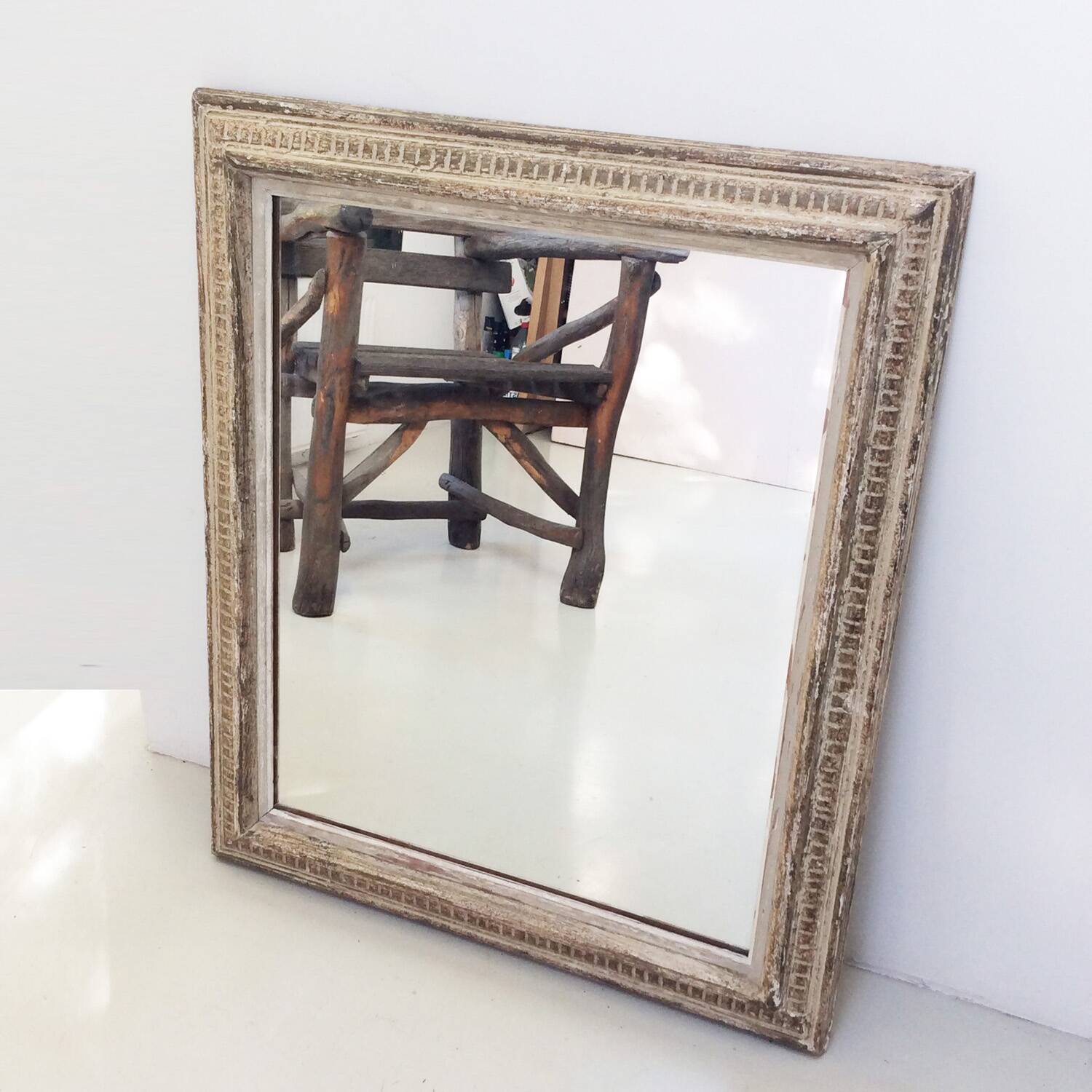 Antique mirror with Montparnasse frame channels