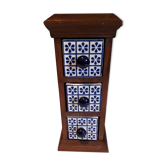 Storage in the form of a small wooden cabinet, with 3 ceramic drawers.