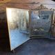 Antique French gilt metal triptych vanity mirror with floral crest