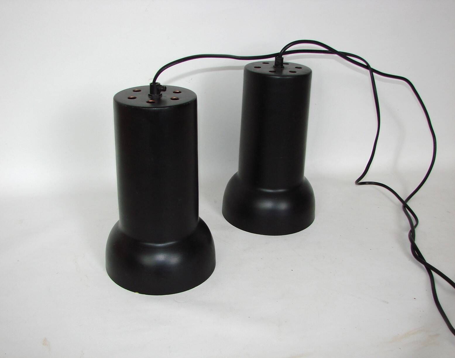 A pair of vintage pendant lights – black brass, modernist
