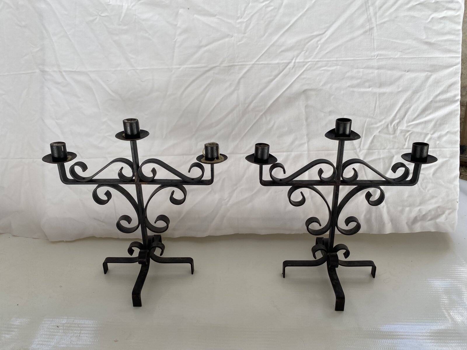Pair of brutalist candlesticks in wrought iron