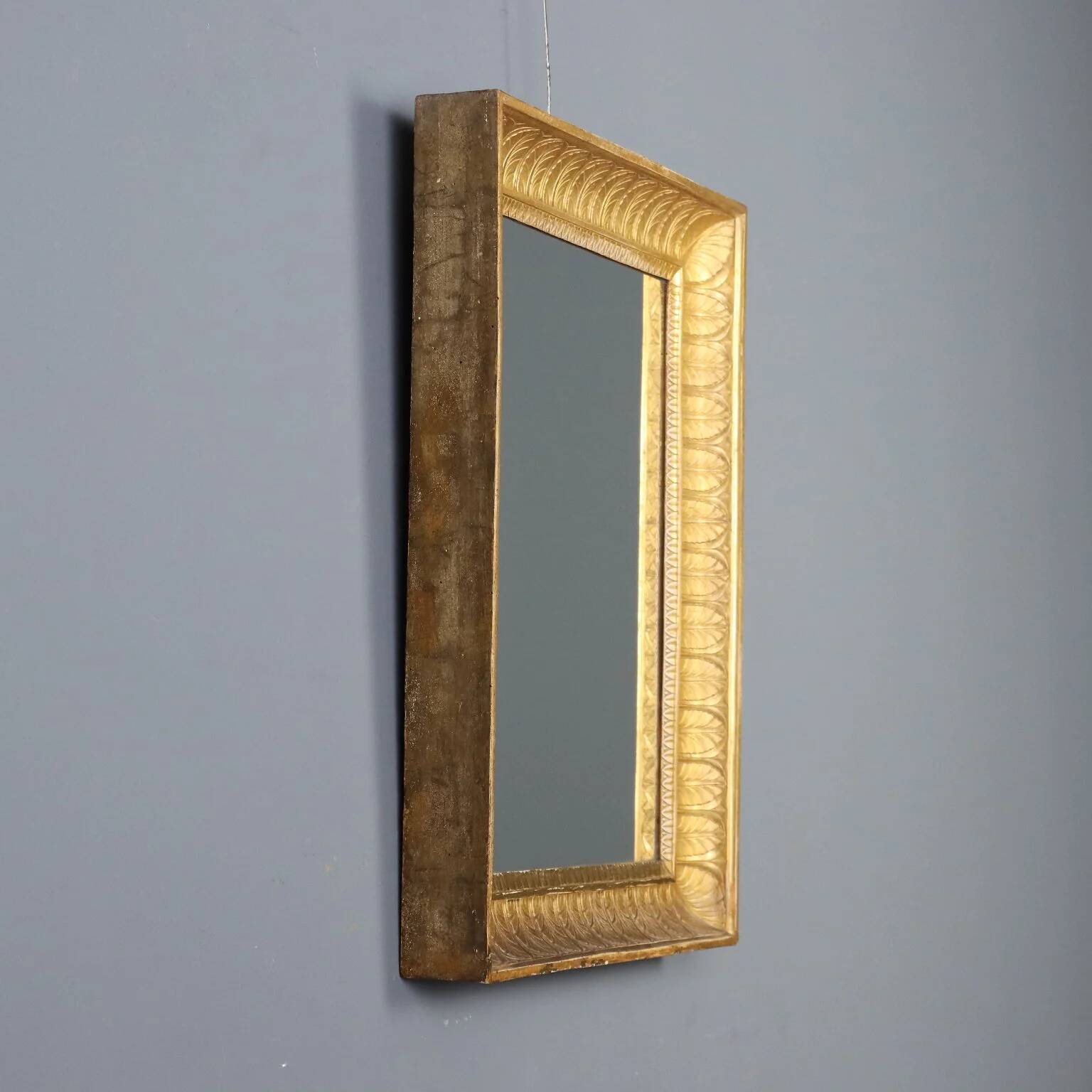Antique Empire mirror in gilded wood, Italy, 19th century.