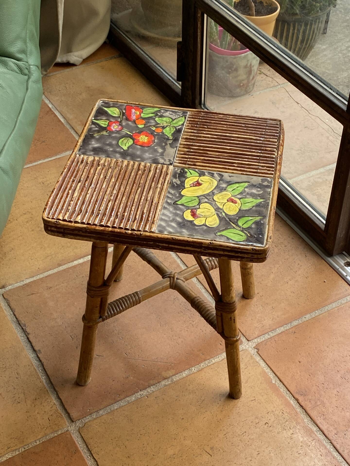 Rattan and ceramic coffee table attributed to Audoux and Minnet.