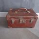 Old cardboard and metal suitcase