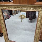 19th century gilt mirror with flowers and foliage decor