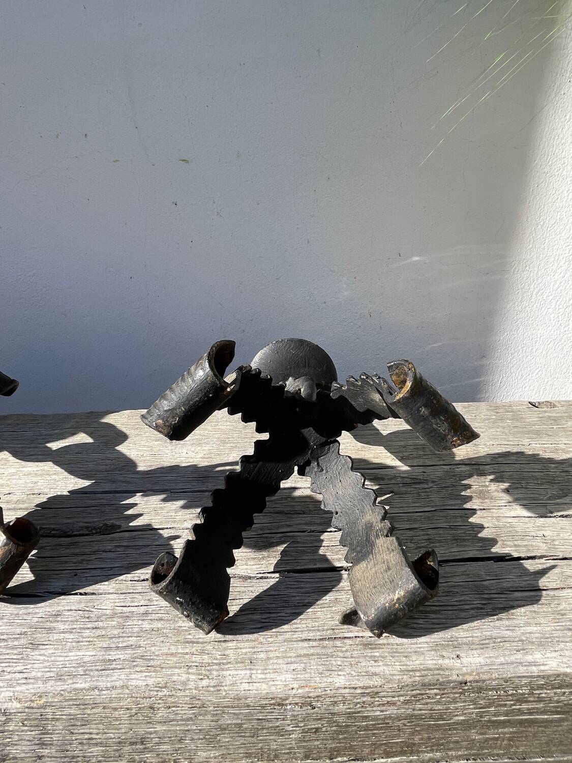 Pair of candlesticks with wrought iron chain