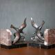 Pair of art deco seagull bookends in regulates and marble, bookcase, desk