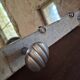 Wall-mounted coat rack with a patinated mirror