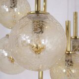 “Cascade” brass chandelier with amber globes
