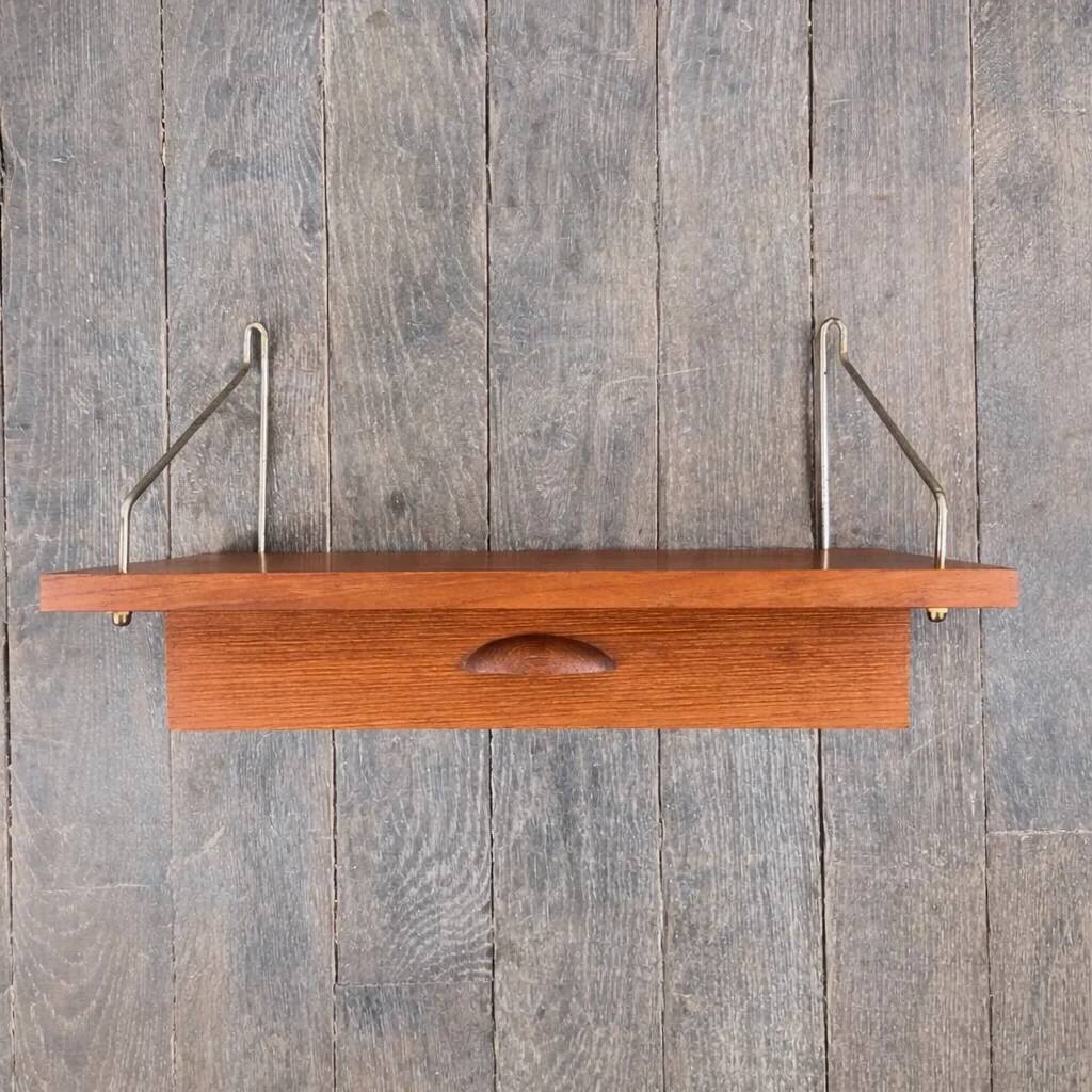 Teak shelf with drawer and brass supports, Denmark, 1960.