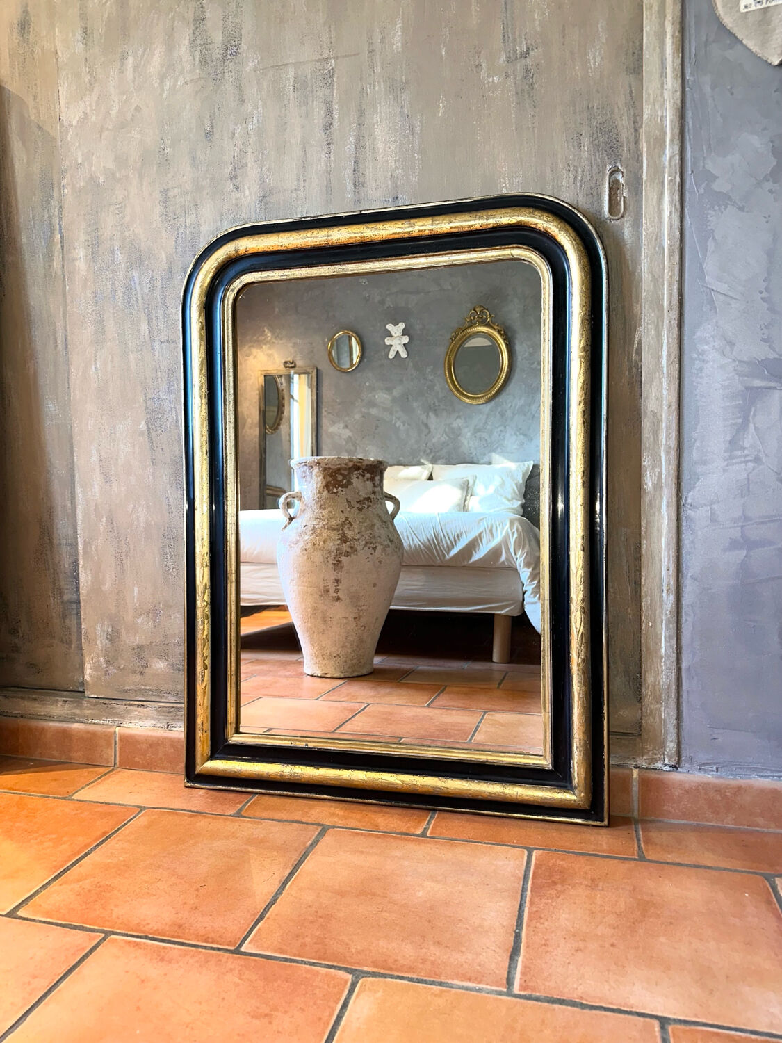 Louis-Philippe black and gold antique mirror from the 19th century