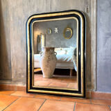 Louis-Philippe black and gold antique mirror from the 19th century