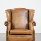 Sheep leather wingback chair with patina