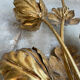 Golden wall lamp foliage
