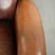 Wingback armchair made of sheepskin leather finished with decorative nails