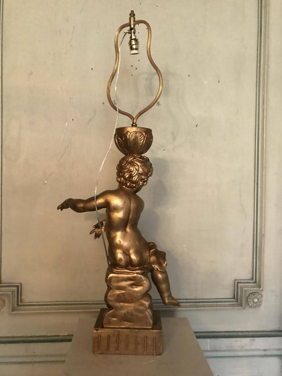 Deux enfants en bois sculpté doré, lampes de table