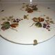 Ceramic plate underside on bronze stand