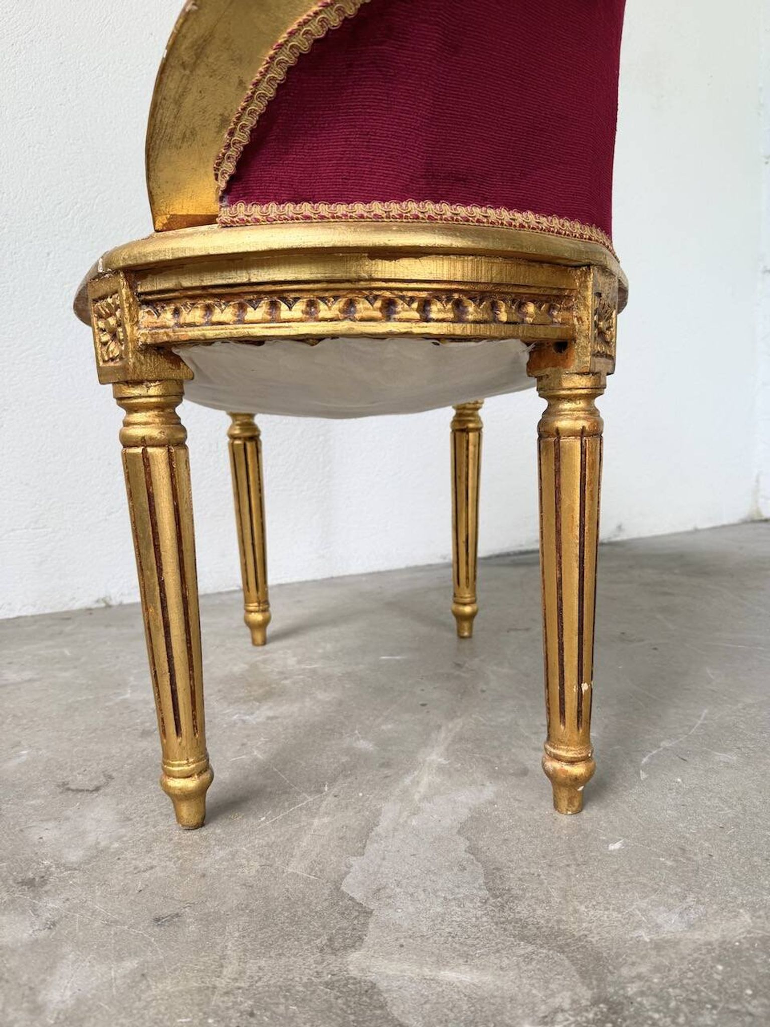 Louis XVI gilt wood and red velvet armchair