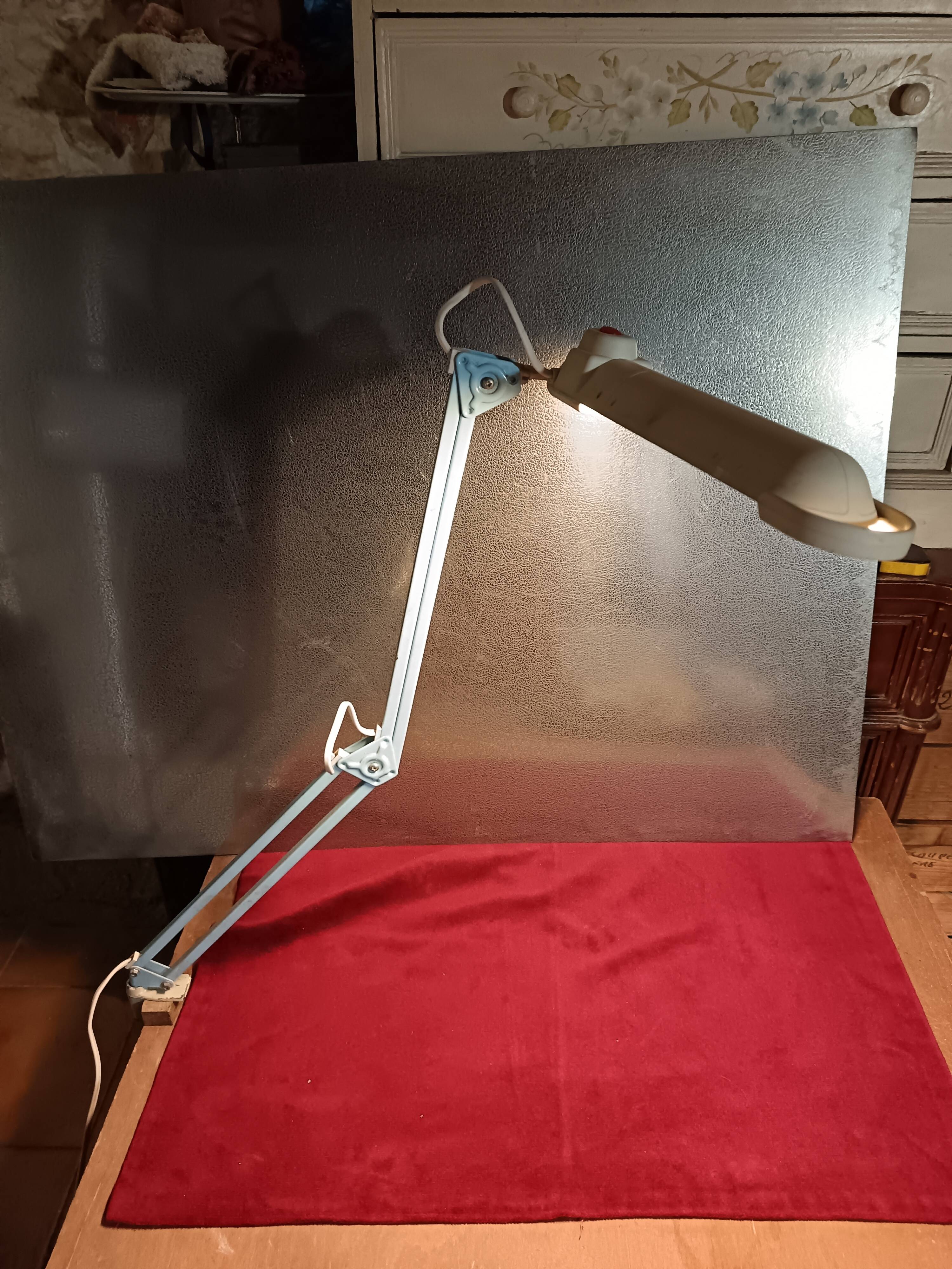 Articulated blue desk lamp
