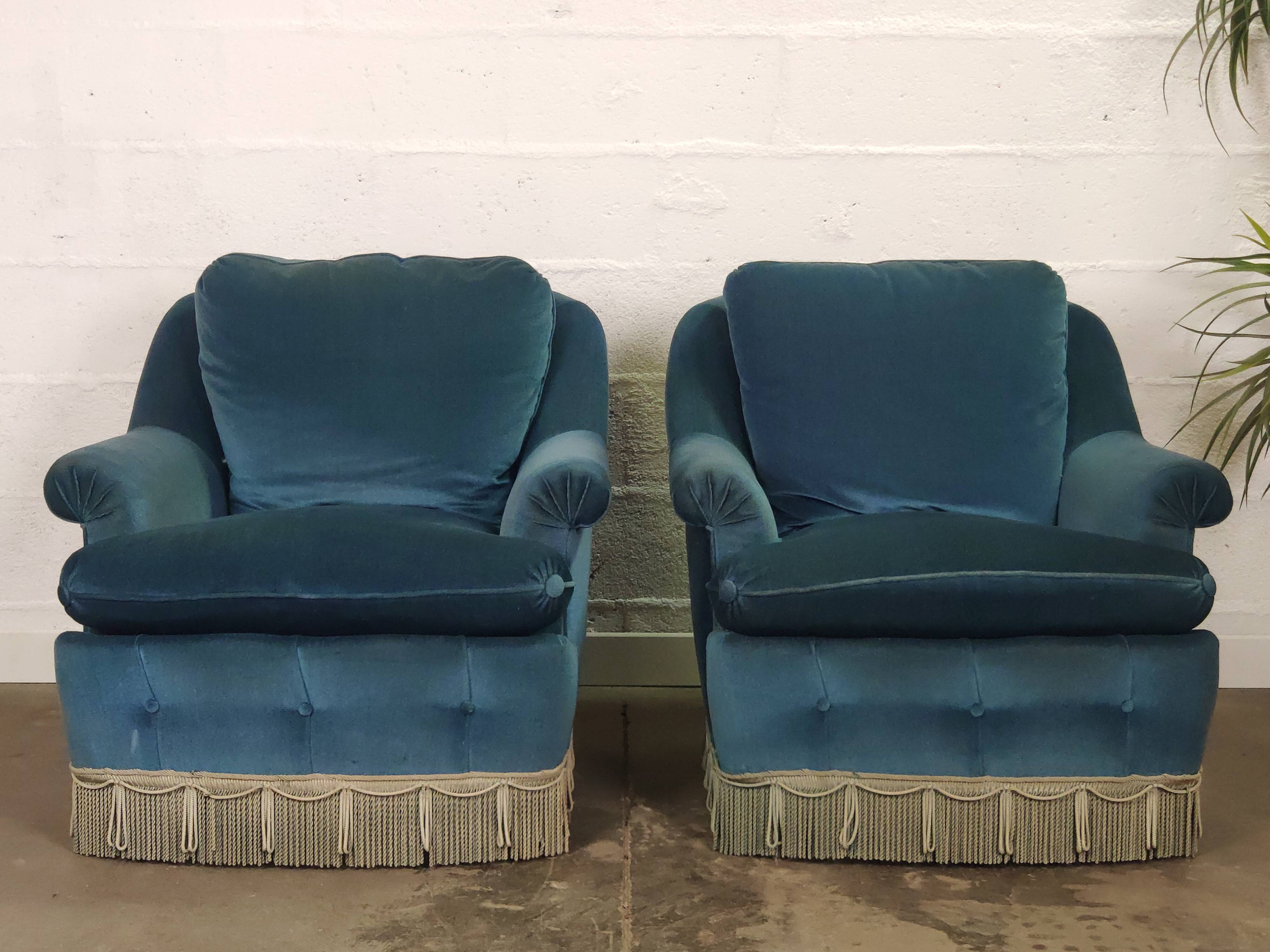 Pair of blue velvet armchairs with fringes
