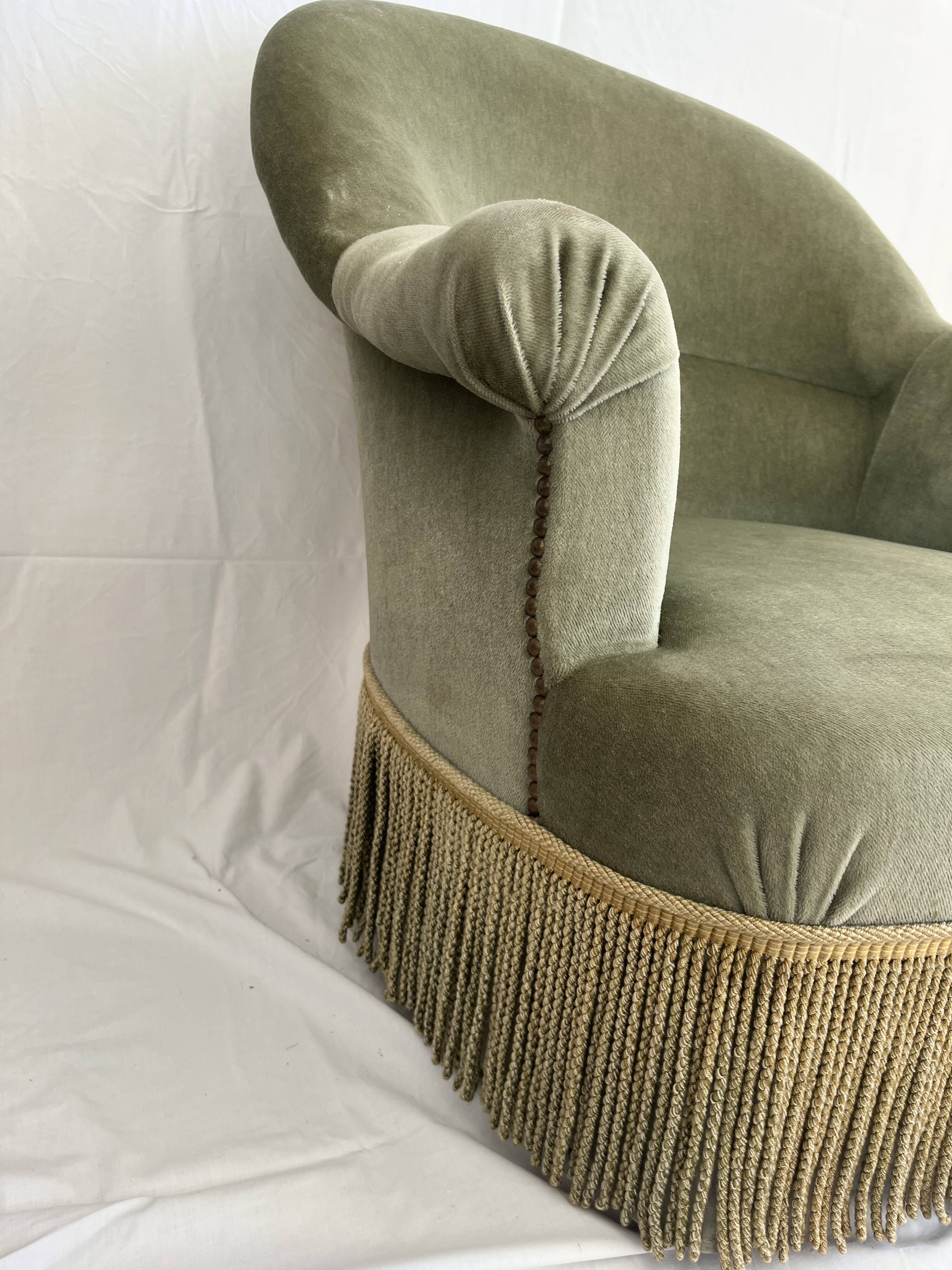 sage green toad armchairs with gold fringe