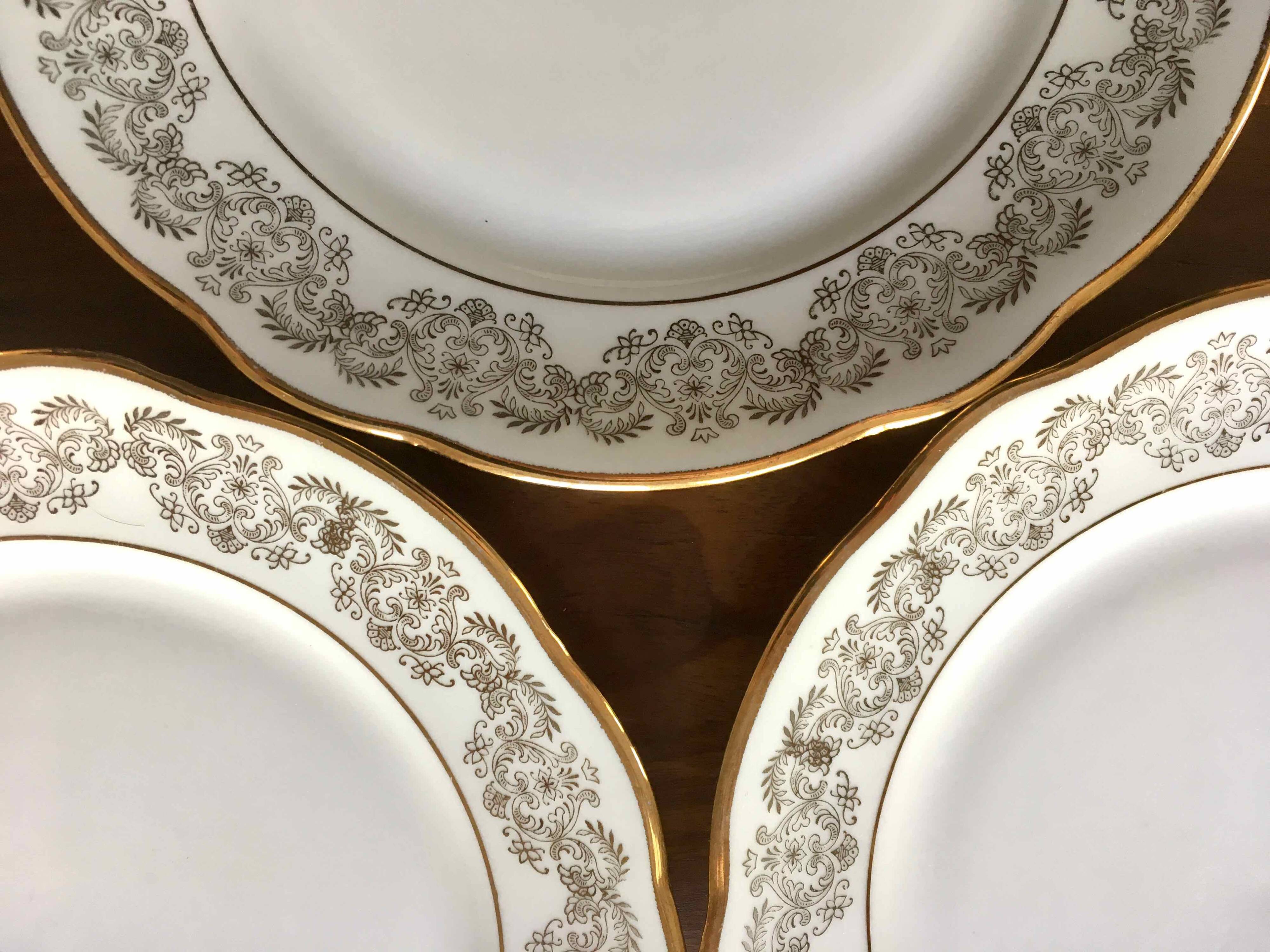 8 white and gold porcelain dessert plates