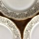 8 white and gold porcelain dessert plates