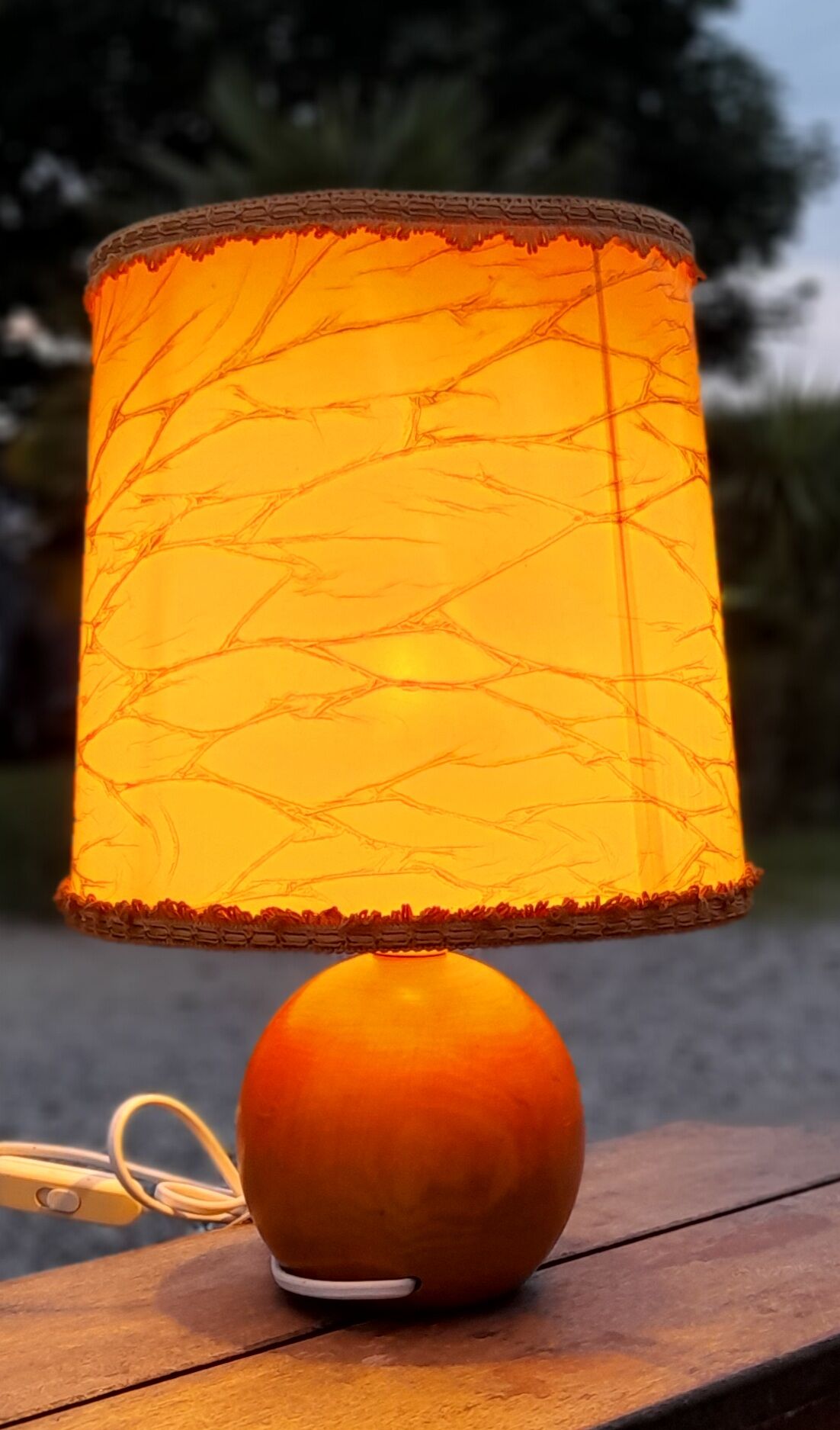 Light wood round foot laying lamp and old lampshade