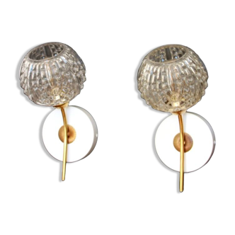 Pair of brass wall lamps and transparent molded glass globes