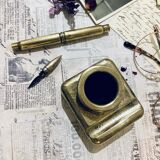 Brass inkwell and old feather holder