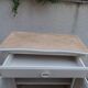 Small vintage buffet reimagined in pearl grey, wooden top.