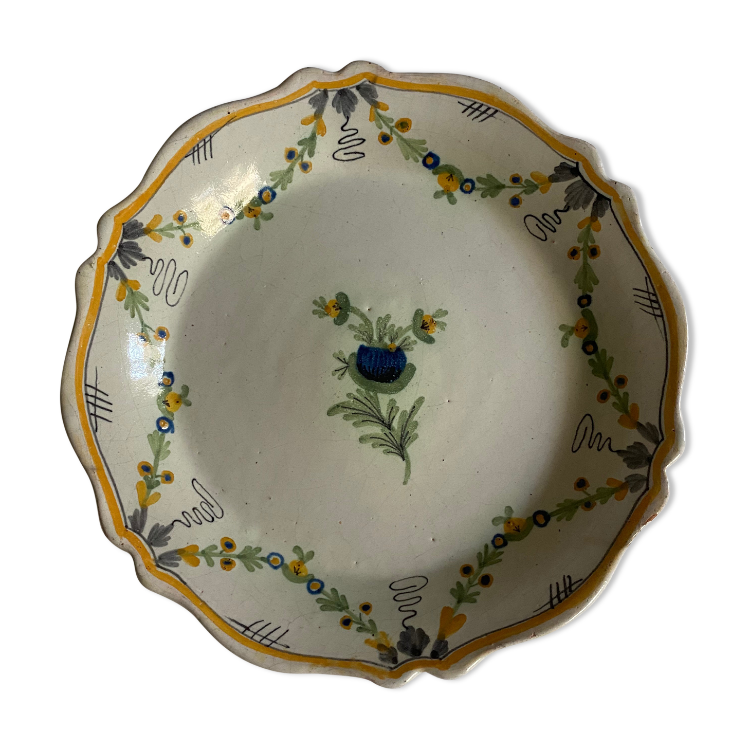 Plate of Nevers in earthenware late eighteenth century decoration of vegetable friezes