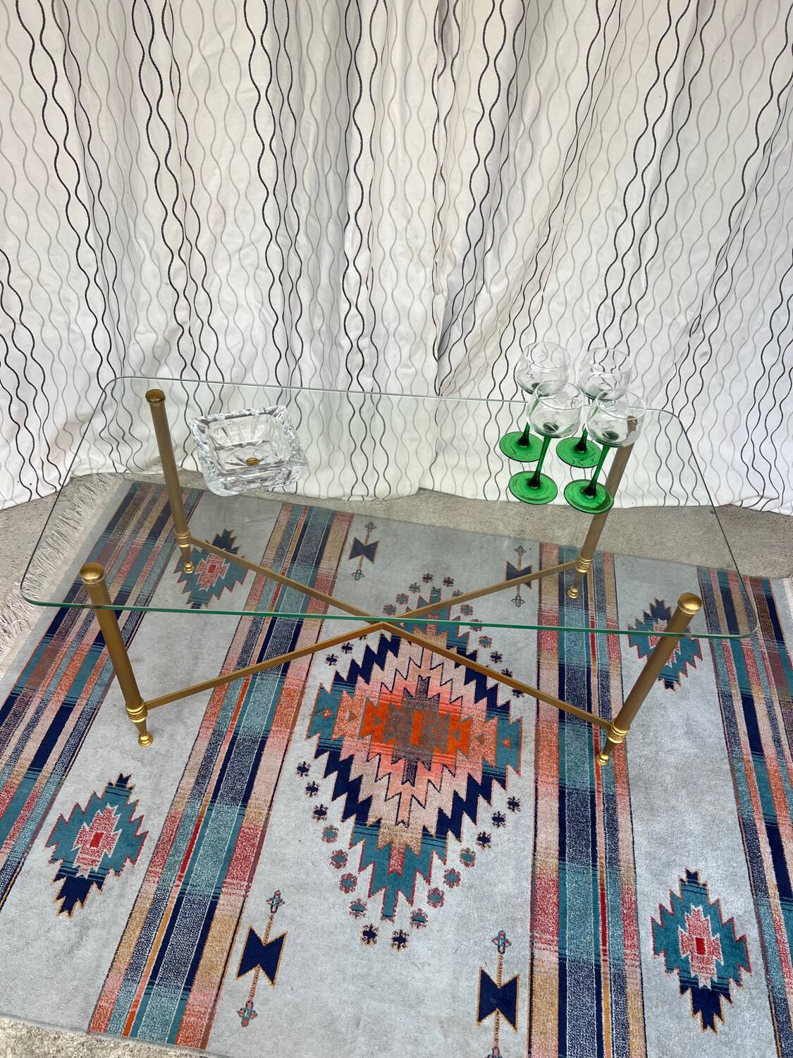 Vintage gold coffee table. Glass top.