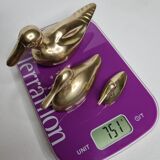 Set of three brass ducks