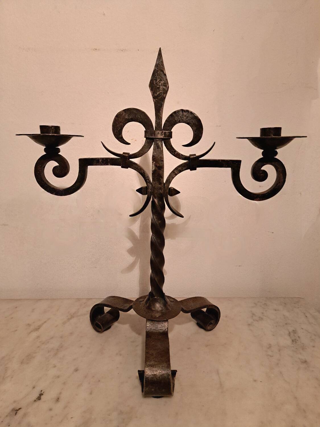 Black wrought iron fleur-de-lis candlestick