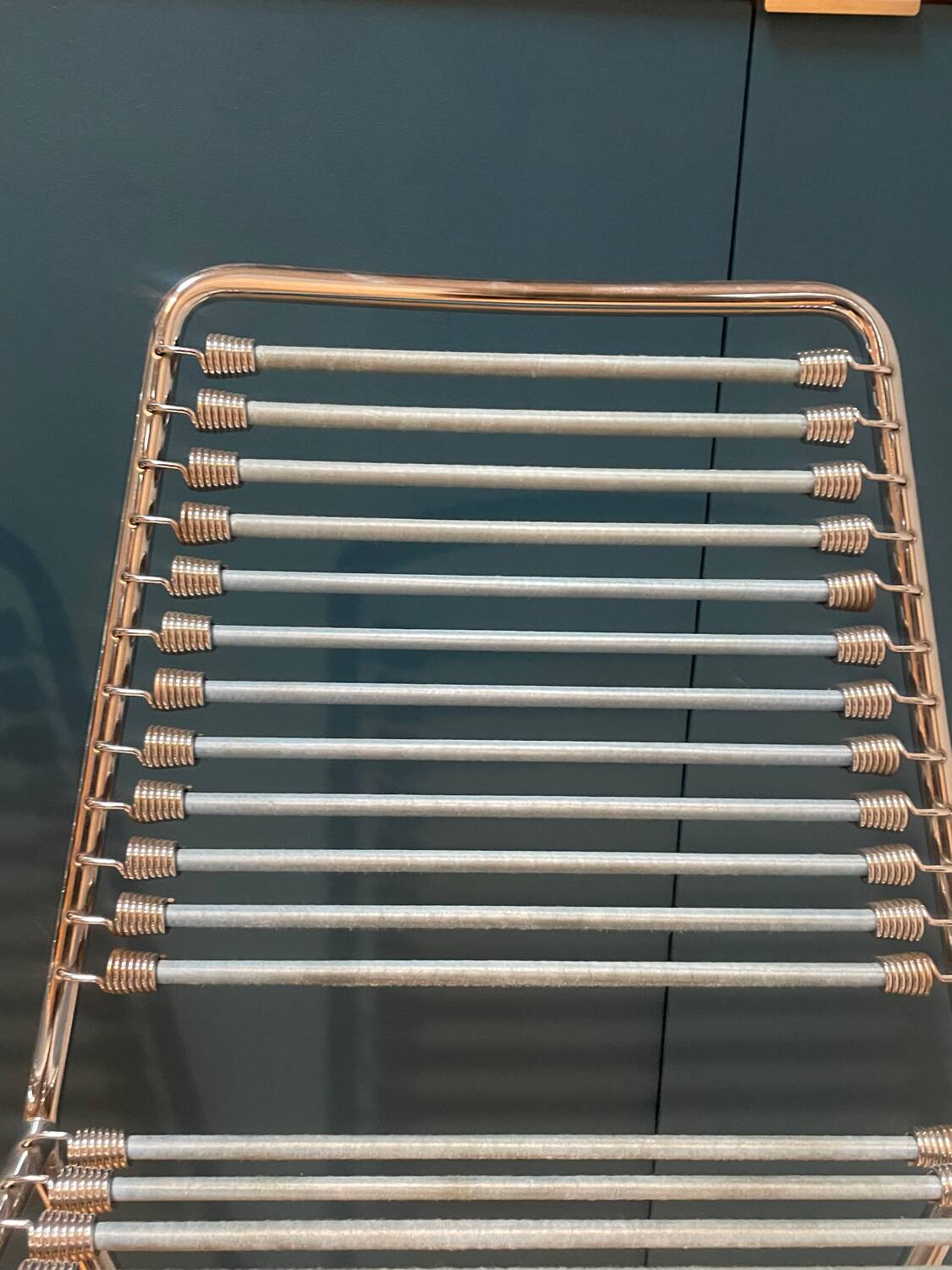 2 metal chairs with bungee cords