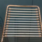 2 metal chairs with bungee cords