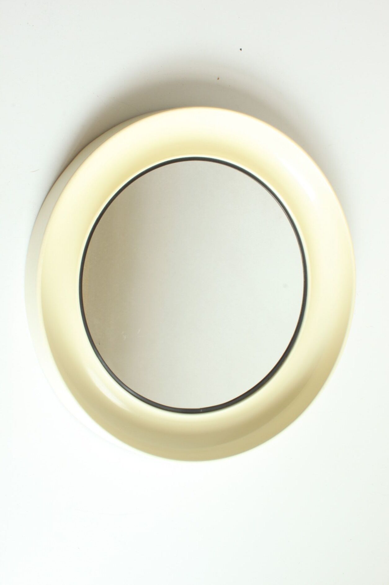 Round conical mirror in white plastic, Denmark 1960s.