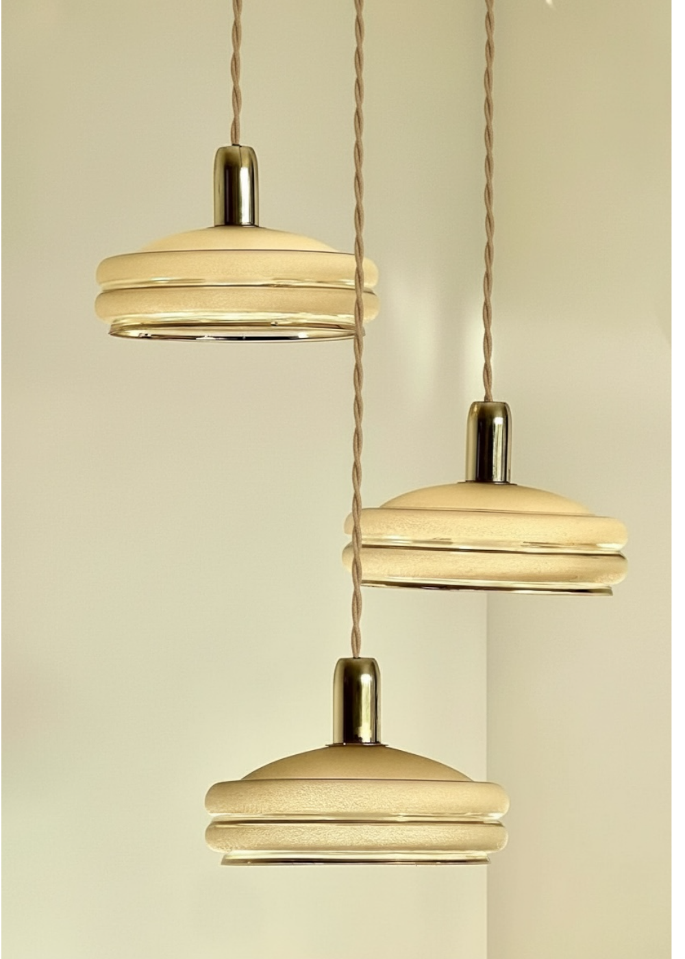 Triple cascade pendant light with vintage frosted glass globes and gold finish