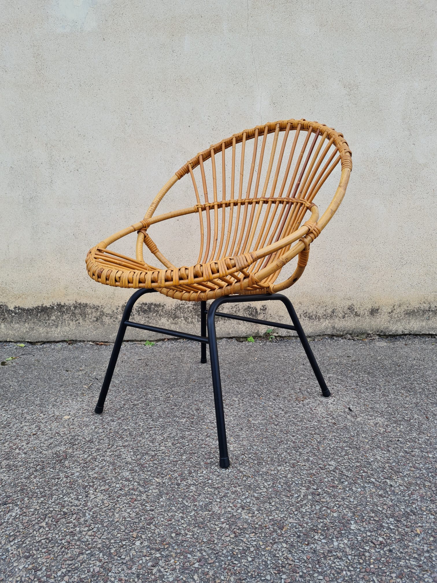 Vintage rattan shell armchair from the 60s