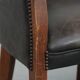 Set of two cowhide and wooden tub chairs with a sturdy colour scheme