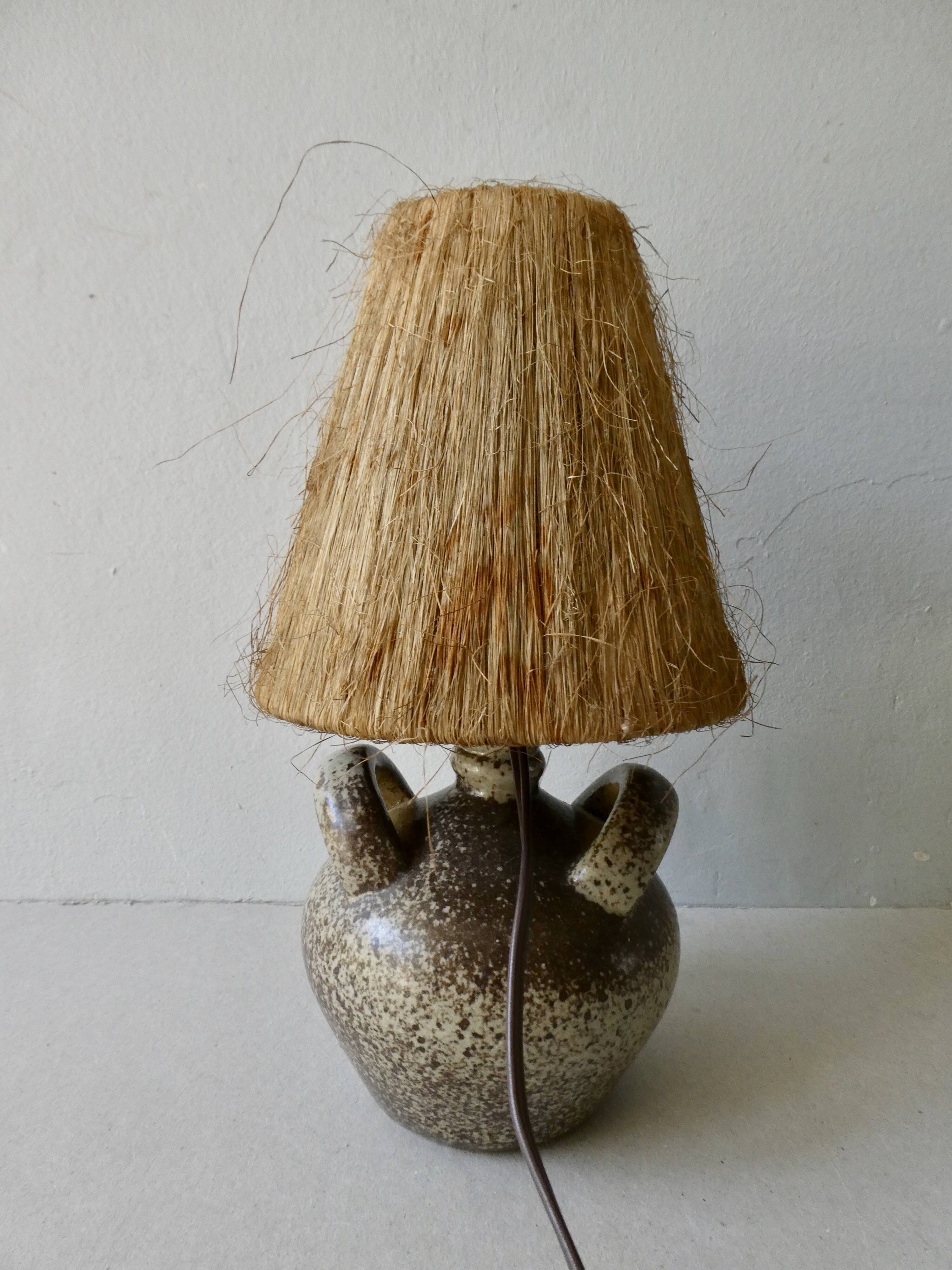 Sandstone lamp with natural fiber lampshade